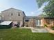 View of the home's backyard showing the patio, siding, and brickwork at 3570 Decamp Dr, Indianapolis, IN 46226