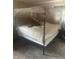 This bedroom features a four poster bed with sheer curtains, creating a relaxing and private space at 3570 Decamp Dr, Indianapolis, IN 46226
