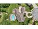 Stunning aerial view of the estate showcasing the pool, manicured grounds, and circular driveway at 3795 Claybrook Ct, Bargersville, IN 46106