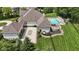 Expansive aerial view showcases the home, swimming pool, large backyard, and three car garage at 3795 Claybrook Ct, Bargersville, IN 46106