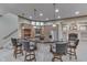 Basement bar with stainless appliances, pendant lighting, and bar seating at 3795 Claybrook Ct, Bargersville, IN 46106