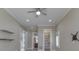 Well-lit bedroom features a ceiling fan, modern shelving, and easy access to nearby bathroom and closet at 3795 Claybrook Ct, Bargersville, IN 46106