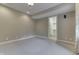 Well-lit bedroom with neutral carpet, a closet, and a decorative ceiling light fixture at 3795 Claybrook Ct, Bargersville, IN 46106