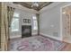 Cozy bedroom with a fireplace, ceiling fan, rug, and large windows with decorative curtains at 3795 Claybrook Ct, Bargersville, IN 46106