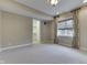 Cozy bedroom with neutral carpet, a walk-in closet, and a window with decorative curtains at 3795 Claybrook Ct, Bargersville, IN 46106