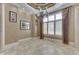 Elegant dining room featuring decorative ceiling, tiled floors and large windows with shutters at 3795 Claybrook Ct, Bargersville, IN 46106