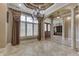 Elegant dining room featuring decorative ceiling, tiled floors and large windows with shutters at 3795 Claybrook Ct, Bargersville, IN 46106