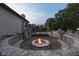 Inviting outdoor fire pit surrounded by stone seating, perfect for evening gatherings and relaxation at 3795 Claybrook Ct, Bargersville, IN 46106