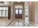 Grand foyer features decorative tile floor, detailed ceiling, and elegant front doors at 3795 Claybrook Ct, Bargersville, IN 46106