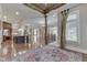 Bright foyer with hardwood floors, decorative rug, stylish post, kitchen island and many windows at 3795 Claybrook Ct, Bargersville, IN 46106