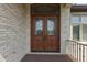Beautiful double front door with decorative glass inserts set in light brick at 3795 Claybrook Ct, Bargersville, IN 46106