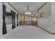 Open game room area with brick accents, custom millwork, and neutral paint at 3795 Claybrook Ct, Bargersville, IN 46106