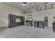 This garage is equipped with epoxy flooring, built-in storage, overhead racks and a workbench at 3795 Claybrook Ct, Bargersville, IN 46106