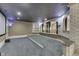 Finished basement home theater room features tiered seating and projector at 3795 Claybrook Ct, Bargersville, IN 46106