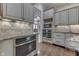 An additional oven is built into the cabinetry in the kitchen, along with the microwave and plenty of storage at 3795 Claybrook Ct, Bargersville, IN 46106