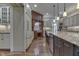 Spacious kitchen with large center island, stainless steel appliances, custom cabinetry, and hardwood floors at 3795 Claybrook Ct, Bargersville, IN 46106