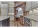 Gourmet kitchen features a professional-grade gas range, custom hood, granite countertops, and tiled backsplash at 3795 Claybrook Ct, Bargersville, IN 46106