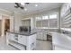 Spacious laundry room featuring granite countertops, ample storage, and a convenient workstation at 3795 Claybrook Ct, Bargersville, IN 46106