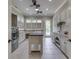 Well-equipped laundry room with center island and generous counter space making chores a breeze at 3795 Claybrook Ct, Bargersville, IN 46106