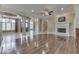 Spacious living area featuring hardwood flooring, fireplace, decorative tile and ornate columns at 3795 Claybrook Ct, Bargersville, IN 46106
