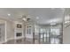 Spacious living room features hardwood flooring, fireplace, and many windows with plantation shutters at 3795 Claybrook Ct, Bargersville, IN 46106