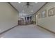 Open living room boasts neutral carpet, recessed lighting, and open access to other living areas at 3795 Claybrook Ct, Bargersville, IN 46106