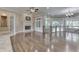 Spacious living room features hardwood flooring, fireplace, and many windows with plantation shutters at 3795 Claybrook Ct, Bargersville, IN 46106