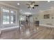 Spacious living room features hardwood flooring, fireplace, and many windows with plantation shutters at 3795 Claybrook Ct, Bargersville, IN 46106