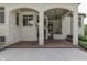 Elegant outdoor entertaining area with a built in kitchen, stainless steel appliances and brick columns at 3795 Claybrook Ct, Bargersville, IN 46106