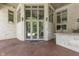 Back patio with white brick surround, outdoor TV, stainless steel appliances, and access to back yard at 3795 Claybrook Ct, Bargersville, IN 46106