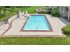 Backyard featuring a swimming pool, manicured lawn, slide and concrete patio at 3795 Claybrook Ct, Bargersville, IN 46106