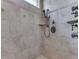 Close up of tiled shower with multiple shower heads, shelving and custom tile at 3795 Claybrook Ct, Bargersville, IN 46106