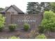 Welcoming brick community sign, beautifully landscaped with flowering plants and mature trees at 3795 Claybrook Ct, Bargersville, IN 46106