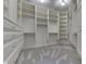 Spacious walk-in closet featuring custom shelving and drawers providing optimal organization at 3795 Claybrook Ct, Bargersville, IN 46106