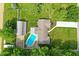 Aerial view of a home with a pool, a barn, and a luscious green lawn at 3905 E 550 S, Lebanon, IN 46052