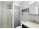 Bathroom with a shower stall, toilet, vanity with a marble countertop, a mirror, and storage at 3905 E 550 S, Lebanon, IN 46052