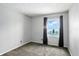 Bedroom featuring gray walls, plush carpet, a window and black out drapes at 3905 E 550 S, Lebanon, IN 46052