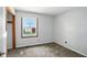 Neutral bedroom featuring plush carpet, a bright window overlooking the pool, and gray walls at 3905 E 550 S, Lebanon, IN 46052