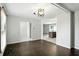 Dining room with hardwood floors, light fixture, and archway leading into an open kitchen at 3905 E 550 S, Lebanon, IN 46052