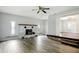 Spacious living room with decorative fireplace, wood floors, and natural light at 3905 E 550 S, Lebanon, IN 46052
