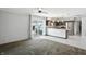 Bright room with an open floor plan and access to the kitchen and sliding door overlooking the pool at 3905 E 550 S, Lebanon, IN 46052