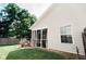 Exterior of home showcasing the backyard with a screened-in porch and wooden fence at 4233 Pearson Dr, Westfield, IN 46062