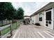 Spacious wooden deck with outdoor seating, privacy fence, and lush green lawn at 4233 Pearson Dr, Westfield, IN 46062