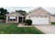 Charming single-story home featuring a brick facade, a two-car garage, and a well-maintained front lawn at 4233 Pearson Dr, Westfield, IN 46062