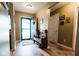 Inviting foyer showcasing hardwood floors, a quaint bench, and a well-lit doorway at 4233 Pearson Dr, Westfield, IN 46062