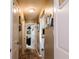 Inviting hallway with wood flooring, neutral paint, and an open doorway into another room at 4233 Pearson Dr, Westfield, IN 46062