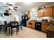 Eat-in kitchen with wood cabinets, a black refrigerator, and a dining table and chairs at 4233 Pearson Dr, Westfield, IN 46062