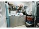 Functional laundry room with washer, dryer, shelving, and ample storage space at 4233 Pearson Dr, Westfield, IN 46062