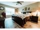 Comfortable main bedroom with ceiling fan, a window, and wood-look floors at 4233 Pearson Dr, Westfield, IN 46062