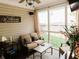 Inviting screened porch with comfortable seating and view of the backyard at 4233 Pearson Dr, Westfield, IN 46062